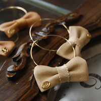 フェイクレザーリボンフープピアス